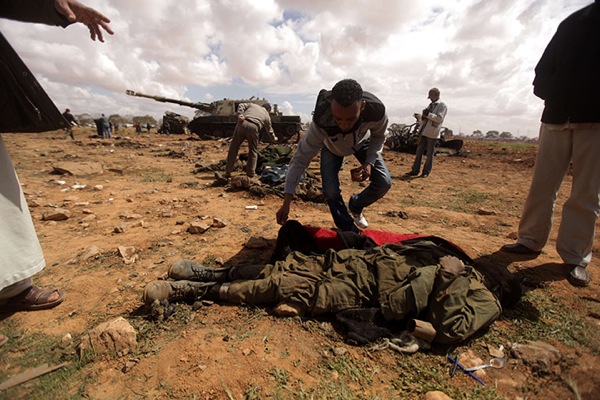 A Libyan rebel empties th 023